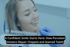 A dental professional holds a shade guide next to a smiling woman’s teeth to match porcelain veneers, ensuring seamless dental restoration for stained or chipped teeth.