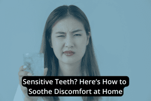 Woman with a pained expression holds a glass of ice water, illustrating sensitive teeth and discomfort. Text overlay offers home remedies to soothe discomfort and provide relief from tooth sensitivity.
