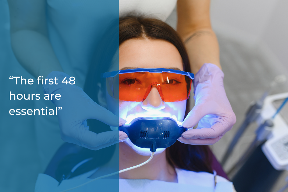 A woman undergoes a teeth whitening procedure at a dental clinic, wearing orange protective glasses and a mouthpiece with blue light. Text on image reads: “The first 48 hours are essential for proper teeth whitening aftercare.”.